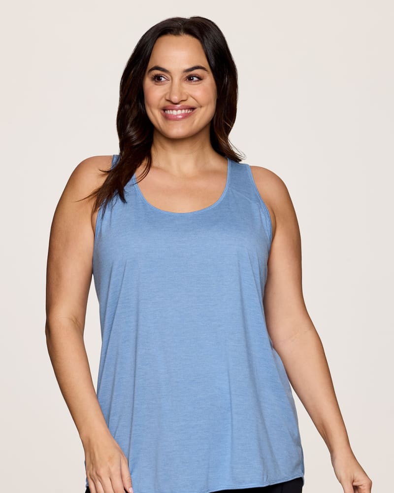 Front of a model wearing a size 2X Prime Relaxed Twist Back Tank Top in Capri Blue by RBX Active. | dia_product_style_image_id:332825